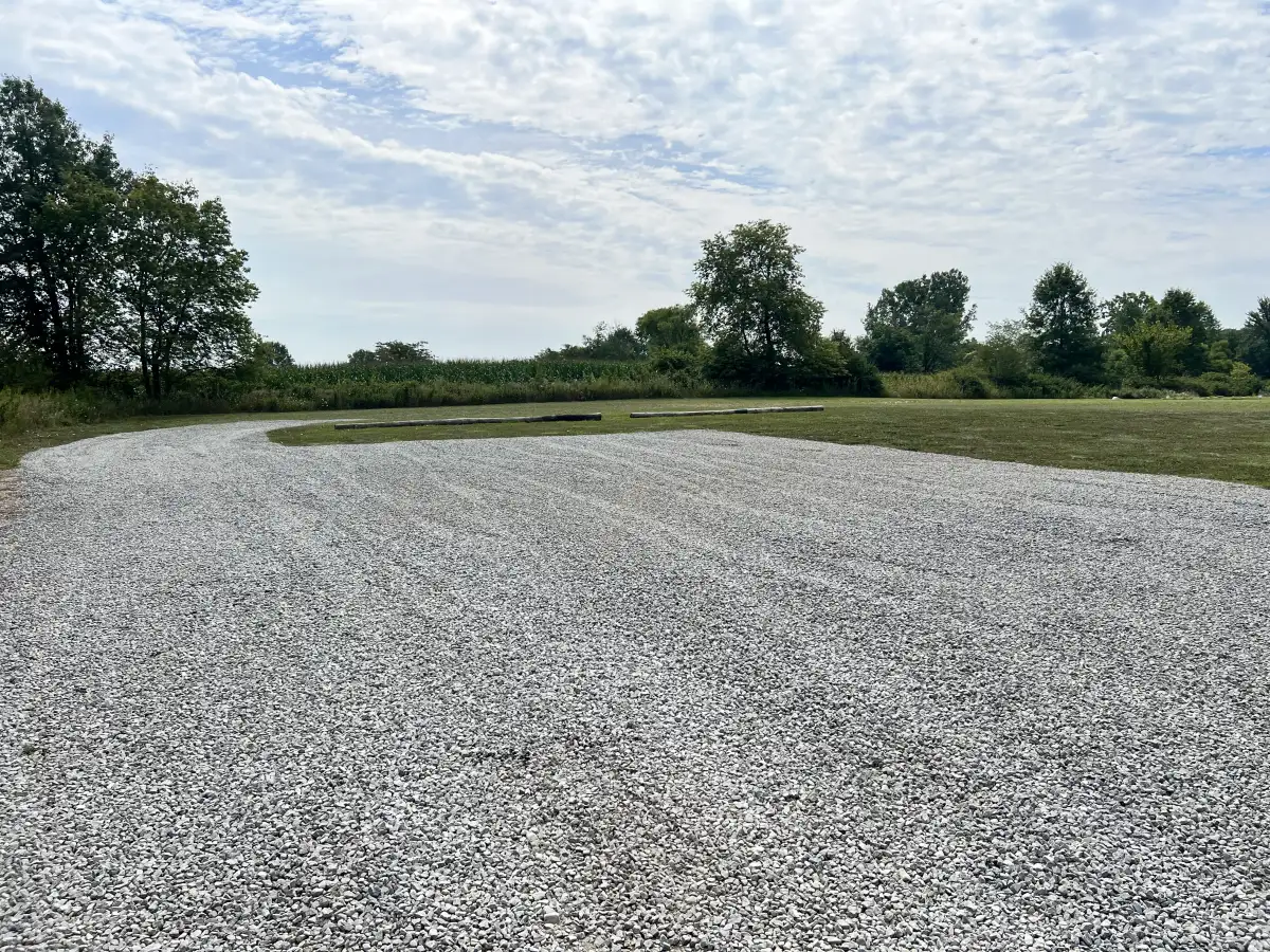 Gravel driveway regrading and fresh stone delivery for a residential client