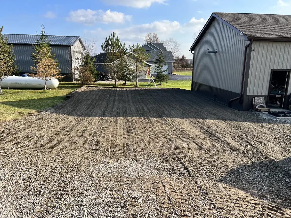 Completed gravel driveway with proper drainage and graded surface